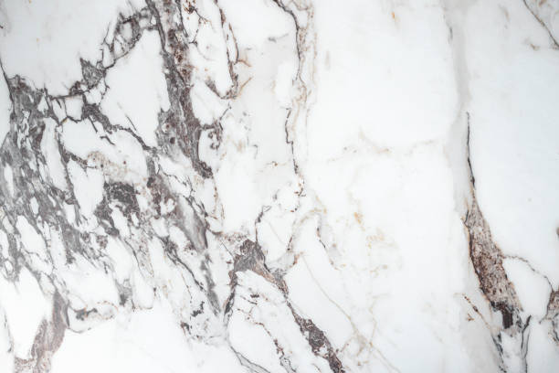 istock White marble stone texture top view. abstract pattern with grey and brown streaks for background or design art 1405284184