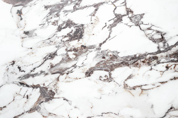 istock White marble stone texture top view. abstract pattern with grey and brown streaks for background or design art 1405284188