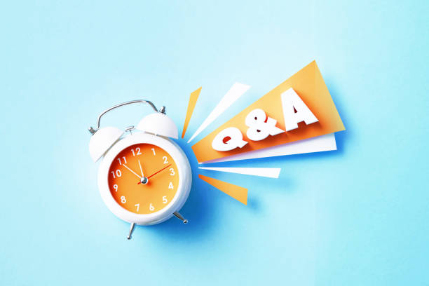 istock Q And A Reads Next To A White Alarm Clock On Blue Background 1405285049