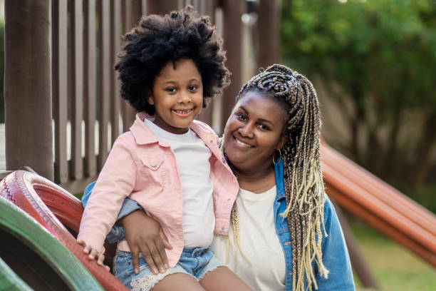 istock Woman and her niece in playground 1405285303