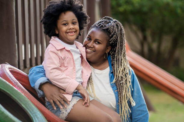 istock Woman and her niece in playground 1405285308
