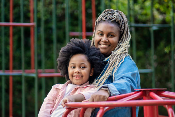 istock Woman and her niece in playground 1405285328