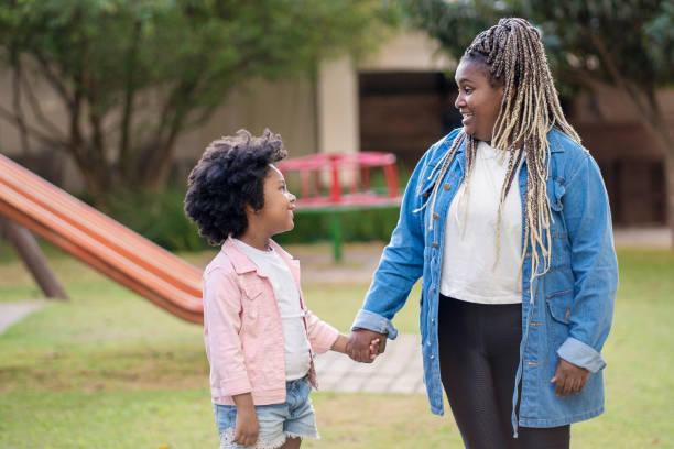 istock Woman and her niece in playground 1405285363