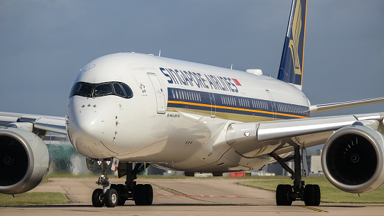 Manchester Airport, United Kingdom - 10 June 2022: Singapore Airlines Airbus A350 (9V-SMK) entering runway 23L for take off to Houston, United States.