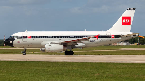Manchester Airport, United Kingdom - 10 June 2022: British Airways Airbus A319 (G-EUPJ  ‘BEA’  retro livery) entering runway 23L for take off to Heathrow.
