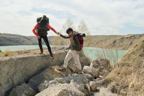 istock Female Tourists Helping Each Other 1405287470