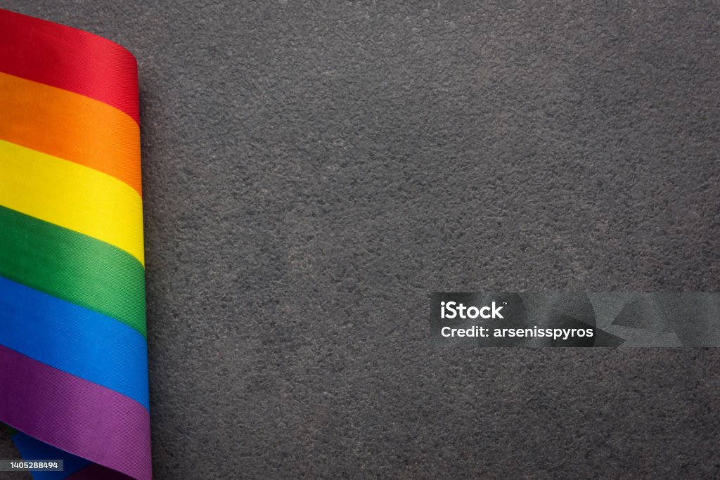 Rainbow flag on gray background with copy space Dark Stock Photo