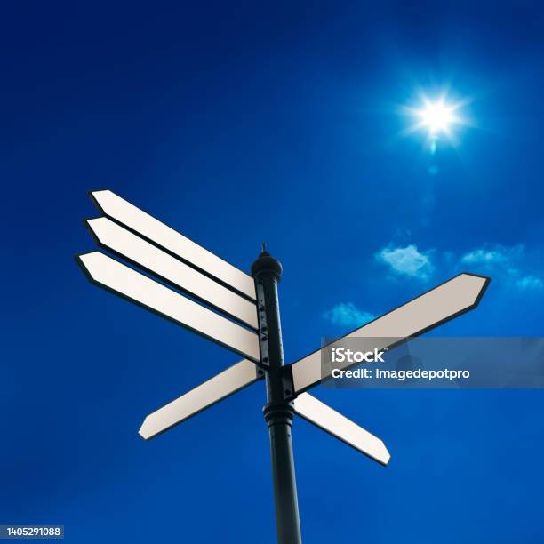 Blank Directional Signs Over Sunny Blue Sky Stock Photo - Download Image Now - Decisions, Road Sign, Choice