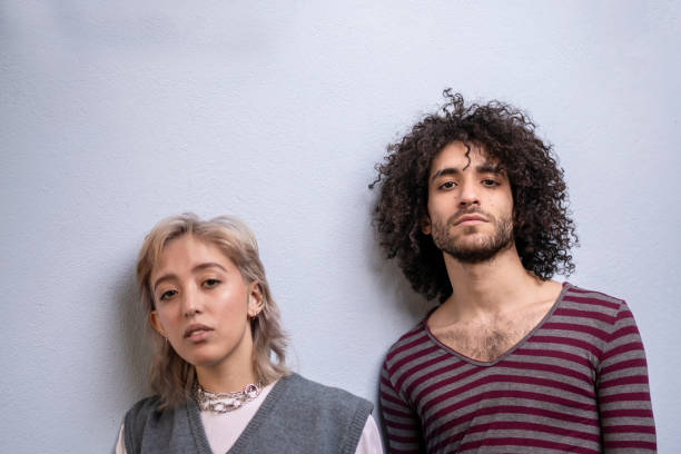 istock Portrait of a non binary person and friend looking at camera 1405291757