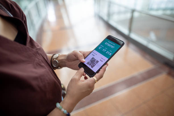 istock Woman checking online boarding pass on smart phone 1405292146