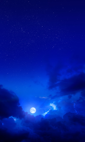 Dramatic dark blue night sky with full moon
