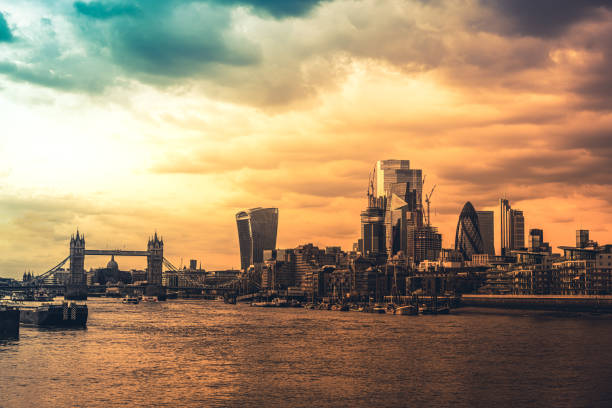 london city financial district skyscrapers overlooking river thames - london england morning sunlight tower bridge imagens e fotografias de stock