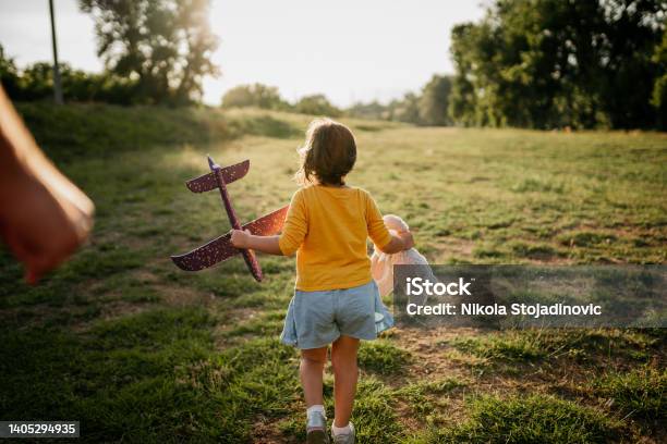 The Father Is Playing With His Daughter And The Plane Stock Photo - Download Image Now