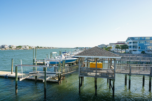 Wrightsville Beach, NC, USA - June 19, 2022: Private home docks with boats at Wrightsville Beach North Carolina