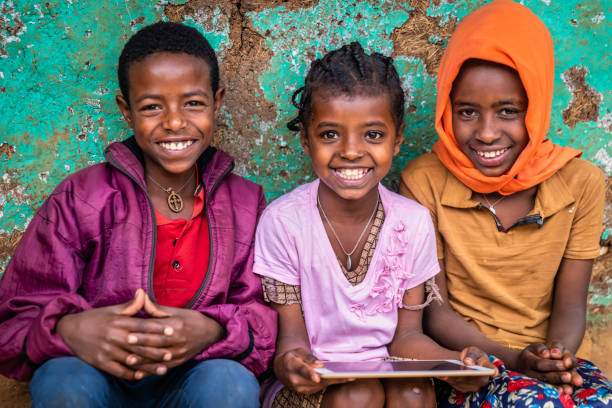 istock African children using digital tablet, East Africa 1405297326