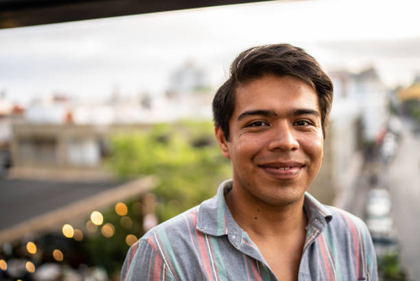 istock Portrait of a happy man at rooftop 1405297876