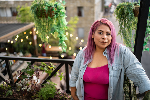 Portrait of mid adult woman at rooftop