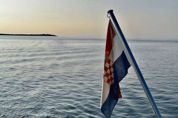 istock Croatian flag on boat at sunset 1405298739