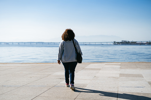 Woman walking in Maua square. Rio de Janeiro, Brazil.