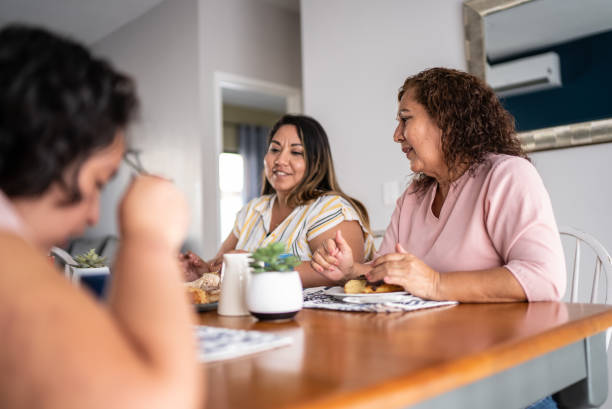istock Mother and daughter having breakfast at home 1405303714