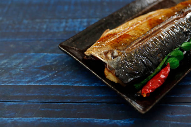 istock Grilled fish dish mackerel on the table 1405304039