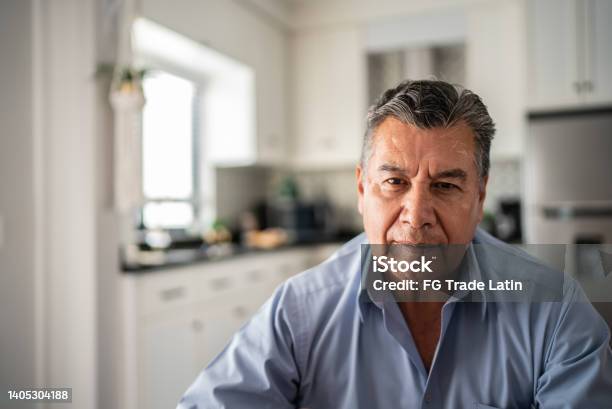 Portrait Of Mature Man At Home Stock Photo - Download Image Now - Mature Men, 55-59 Years, Human Face