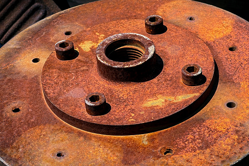 close up of a rusty brake disc pad, for sale as decoration, at a salvage yard, Long Island, New York
