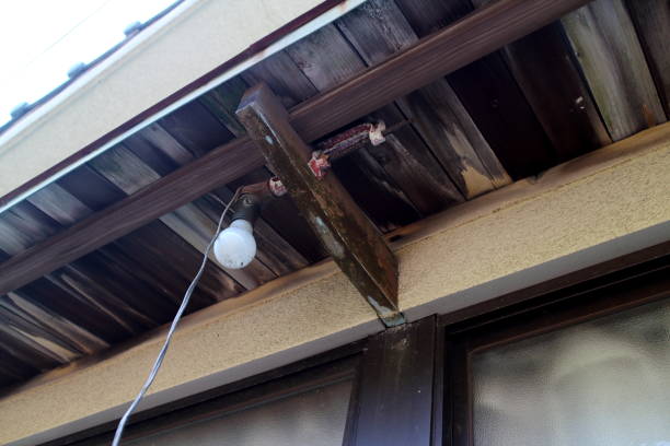 istock Light bulb under the eaves of an old private house 1405305997