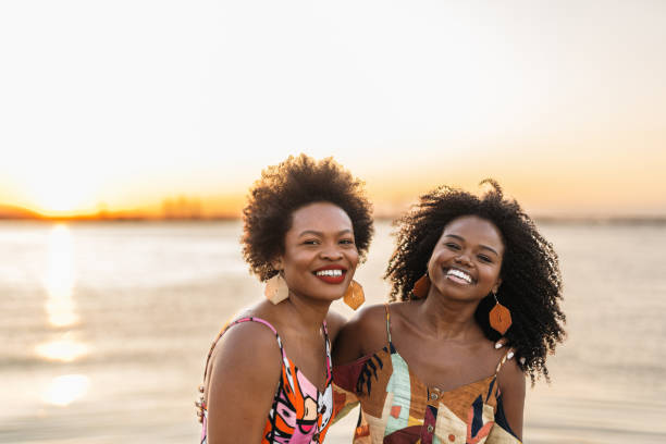 istock Smiling women at sunset on the bay 1405307146