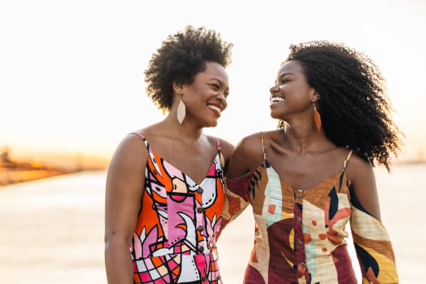 istock Smiling women at sunset on the bay 1405307147