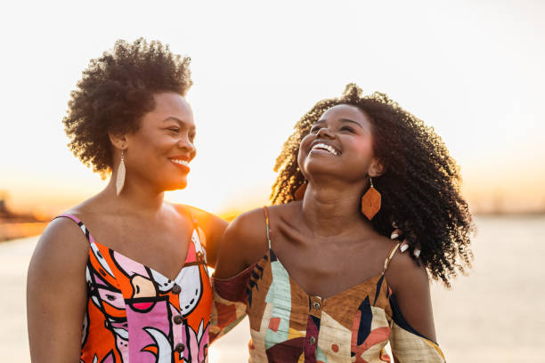istock Smiling women at sunset on the bay 1405307148
