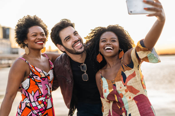 istock Friends taking a selfie at sunset on the bay 1405307150