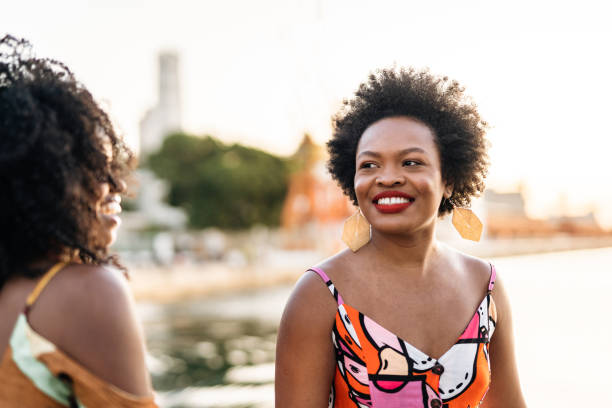 istock Smiling women at sunset on the bay 1405307170
