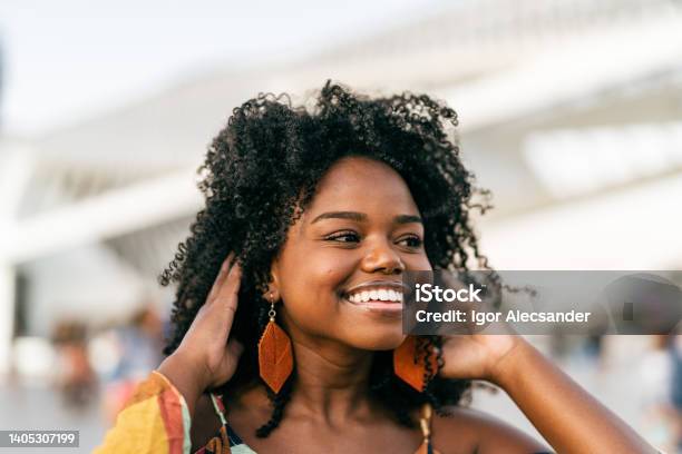 Smiling black woman in the city