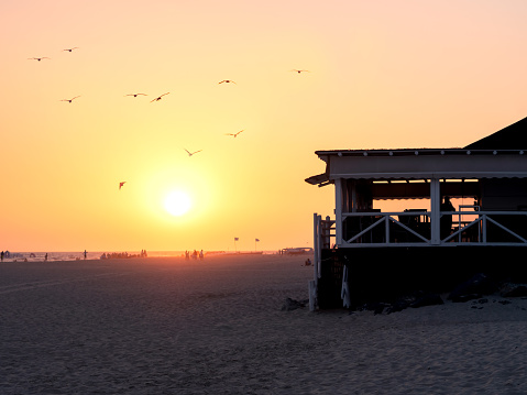 Silhouette of beach bar at sunset