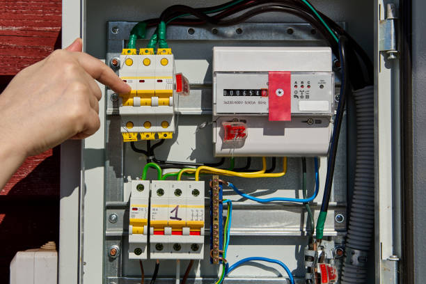 istock Switching circuit breaker in switchboard with  electricity meter. 1405315376
