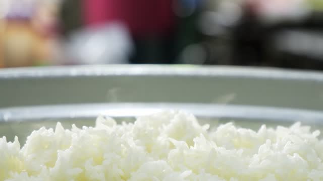 hot steamed rice on the a pot the cook.
