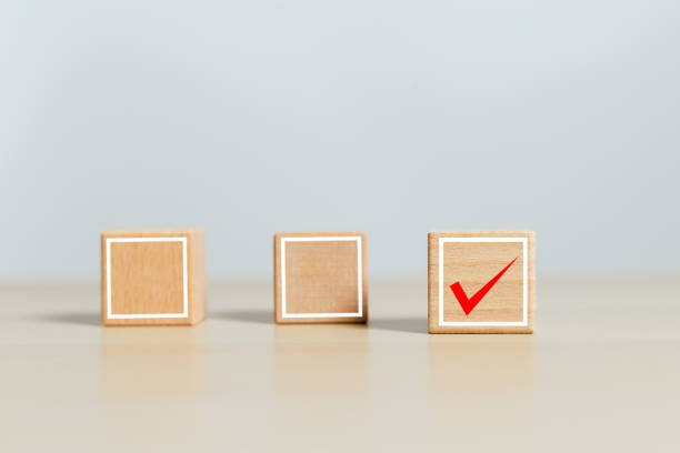 istock Checklist mark concept. wood cube block with tick checklist icon. agreement accept confirm symbol. positive evaluation answer. 1405321053