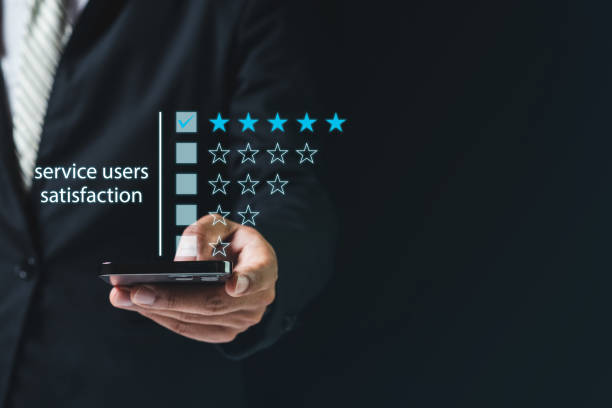 istock Satisfaction from service users concept. businessman using smartphone finger point customer satisfaction check star rating black background, person click button or touch pointing. 1405321062