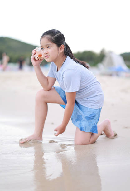 istock Children playing on the beach 1405321378