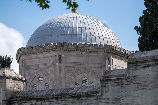 ISTANBUL, TURKEY - NOVEMBER 25, 2021: Suleymaniye Mosque from the courtyard. Muslim ancient building. Architecture of the 16th century.