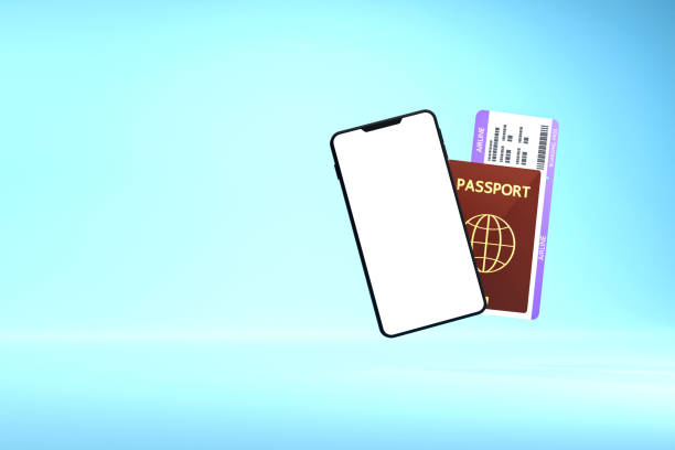 Smartphone with blank screen and passport and plane ticket stock photo