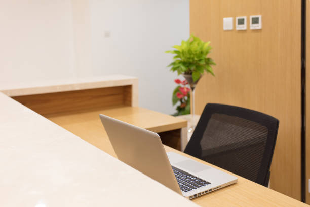 istock Office reception with laptop and chair 1405329968