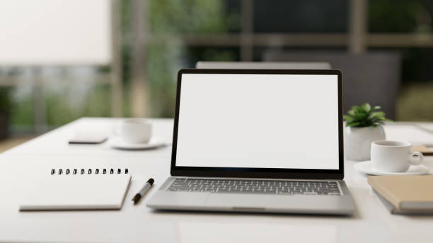 istock Modern office desk workspace or co-working space with portable laptop computer mock-up 1405330985