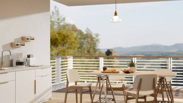 istock Home dining room and kitchen cooking space interior with a balcony with mountain view. 1405330987