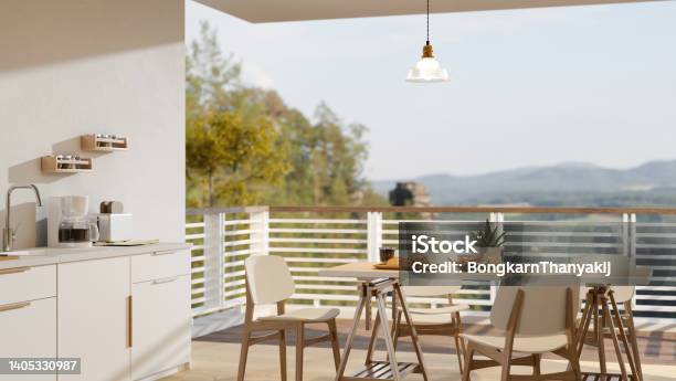 Home Dining Room And Kitchen Cooking Space Interior With A Balcony With Mountain View Stock Photo - Download Image Now