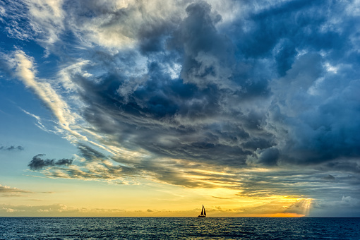 Sunset Sailboat Storm Looming Ocean Clouds