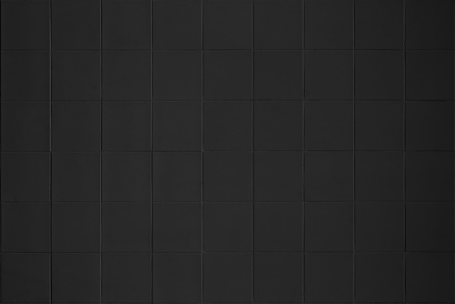 Black tile high resolution real photo. Brick seamless pattern and texture square floor ceramic tiles interior room background. Dark grid tiles wall texture for the bander decoration backdrop.