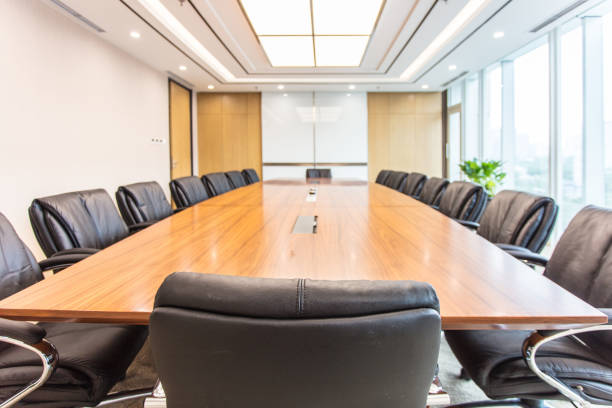 Business meeting room on high rise office building Business meeting room on high rise office building corporate boardroom stock pictures, royalty-free photos & images