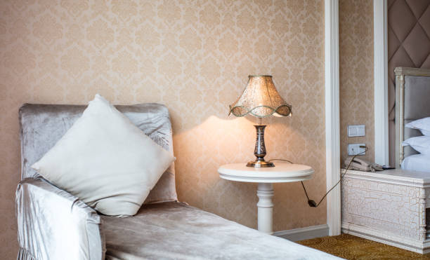 istock Luxury hotel room interior with lamp and sofa 1405337230